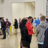 Project day attendees looking at senior projects